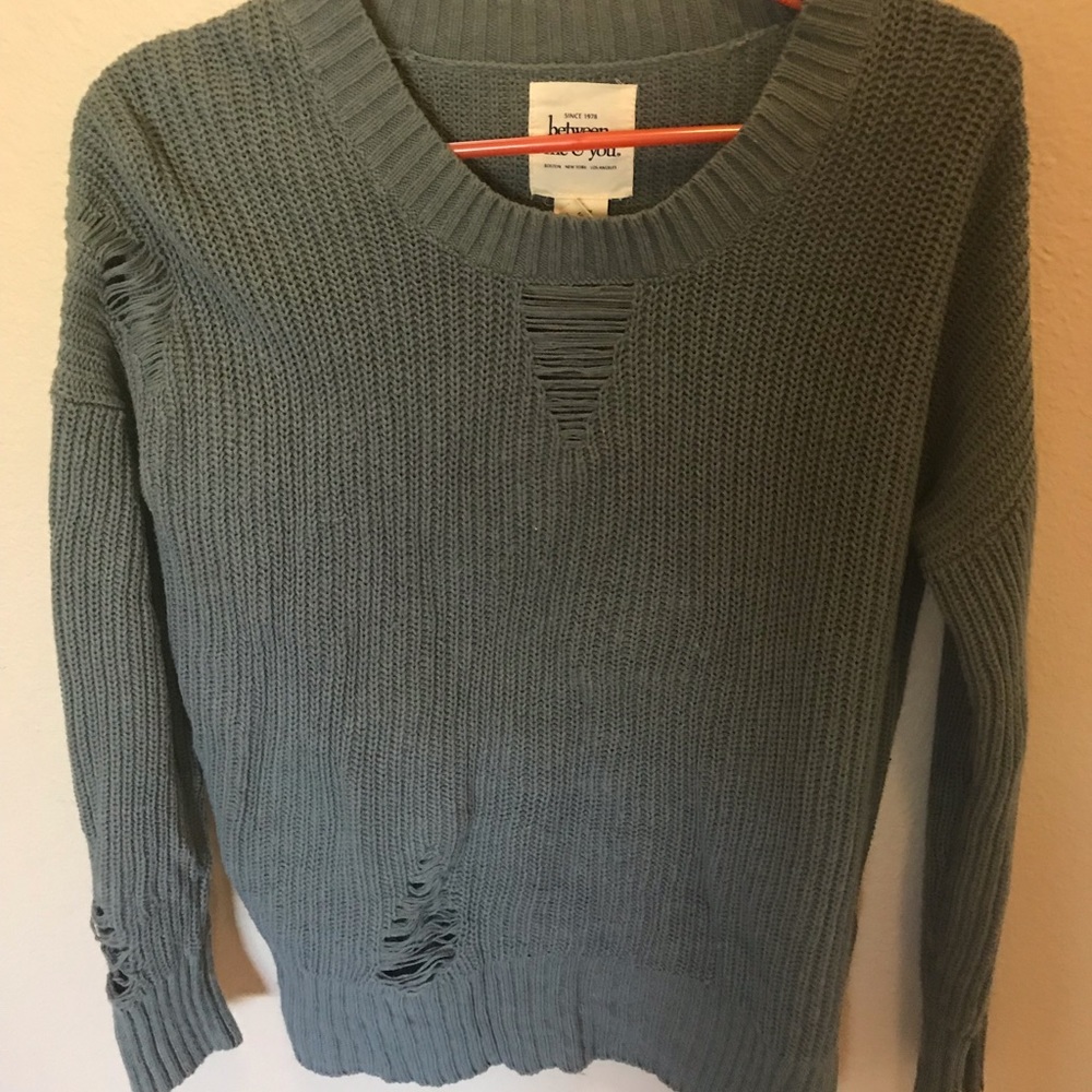 Torn sweater